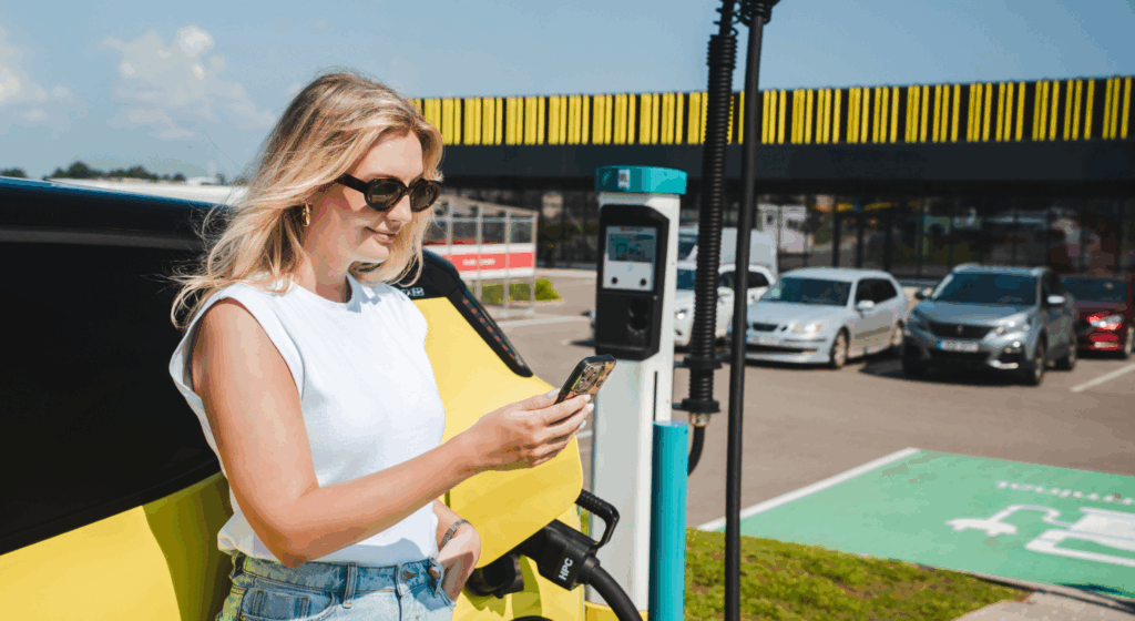 Girl leaning against a car